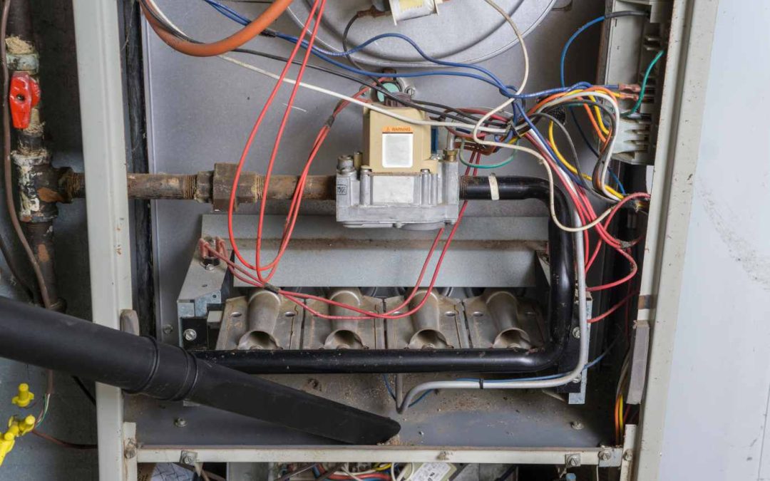 close up of furnace trying to diagnose furnace noise